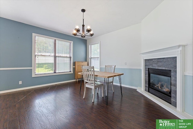 dining space featuring plenty of natural light, a chandelier, and wood finished floors