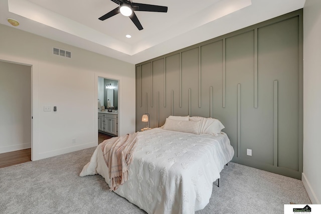 8600 S 50th Ct, Lincoln, NE 68516 - bedroom featuring carpet flooring, a tray ceiling, baseboards, connected bathroom, and recessed lighting