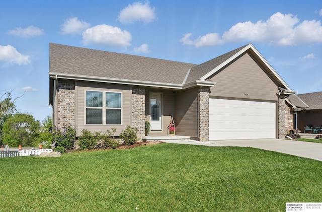 2614 N 191st Ave, Omaha, NE 68022 - view of front facade featuring an attached garage, driveway, brick siding, and a shingled roof