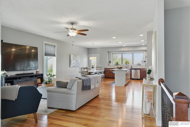 2614 N 191st Ave, Omaha, NE 68022 - living area with light wood finished floors, a ceiling fan, and recessed lighting