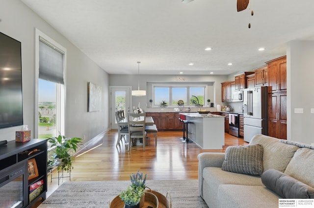 2614 N 191st Ave, Omaha, NE 68022 - living area featuring light wood-type flooring, a ceiling fan, recessed lighting, and baseboards