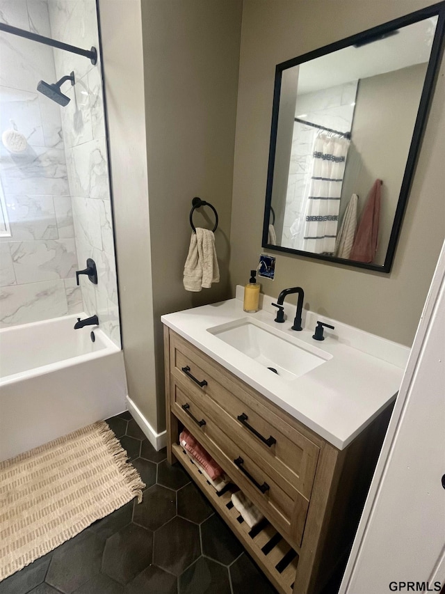 full bath featuring vanity, baseboards, shower / bath combo with shower curtain, and tile patterned floors