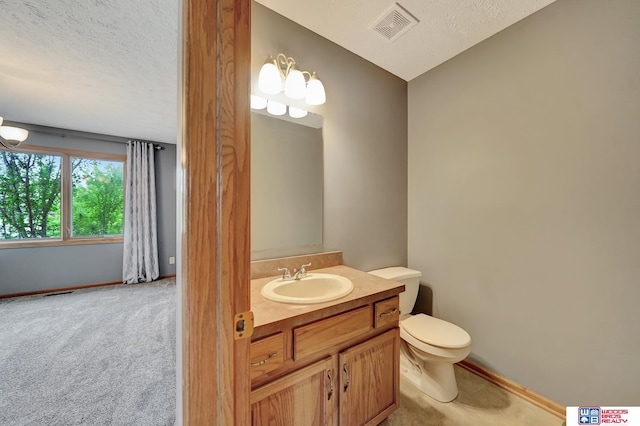 7910 Red Oak Rd, Lincoln, NE 68516 - half bath featuring vanity, toilet, baseboards, and a textured ceiling