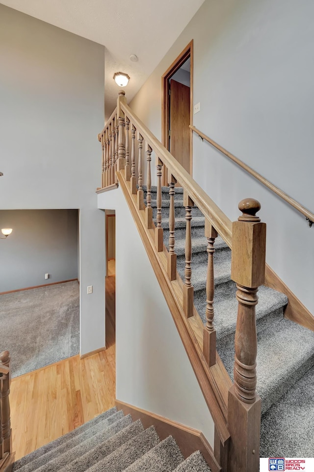 7910 Red Oak Rd, Lincoln, NE 68516 - staircase with wood finished floors and baseboards