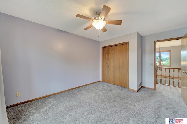 7910 Red Oak Rd, Lincoln, NE 68516 - unfurnished bedroom featuring carpet flooring, baseboards, a closet, and ceiling fan