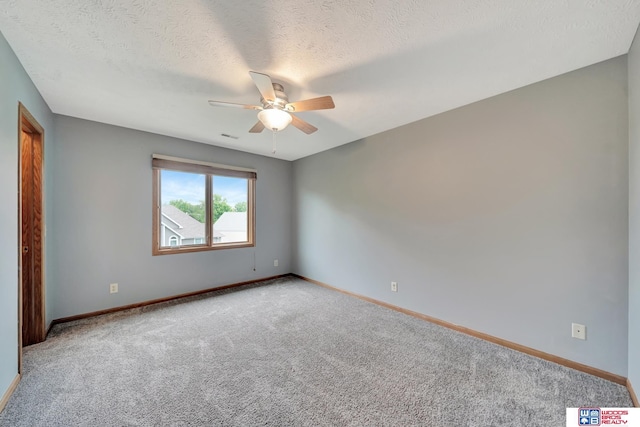7910 Red Oak Rd, Lincoln, NE 68516 - carpeted empty room featuring a ceiling fan, baseboards, and a textured ceiling