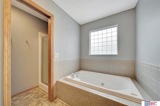 7910 Red Oak Rd, Lincoln, NE 68516 - full bathroom featuring a tub with jets and a stall shower