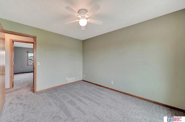 7910 Red Oak Rd, Lincoln, NE 68516 - spare room with carpet floors, ceiling fan, and baseboards