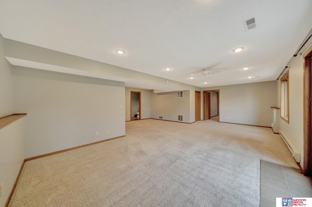 7910 Red Oak Rd, Lincoln, NE 68516 - finished basement with baseboard heating, light carpet, recessed lighting, baseboards, and a ceiling fan