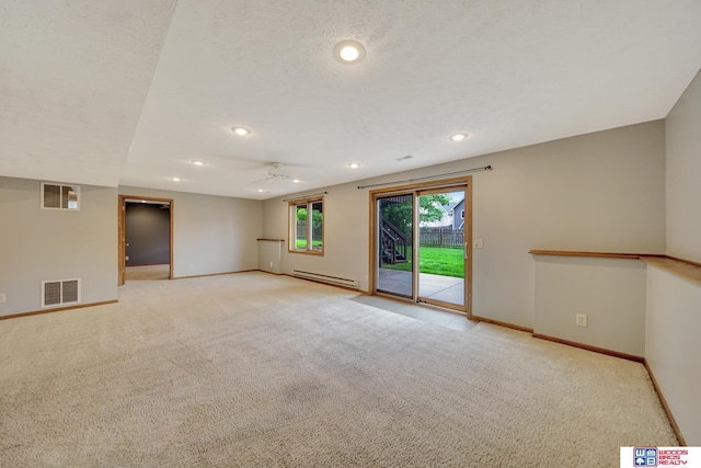 7910 Red Oak Rd, Lincoln, NE 68516 - unfurnished room featuring a baseboard radiator, light colored carpet, baseboards, a ceiling fan, and recessed lighting