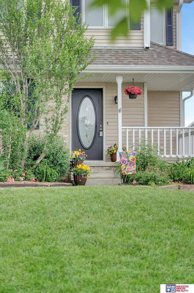 7910 Red Oak Rd, Lincoln, NE 68516 - property entrance featuring a yard and covered porch