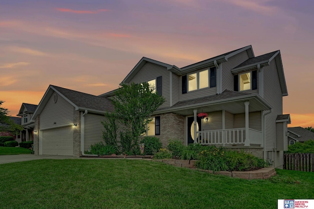 7910 Red Oak Rd, Lincoln, NE 68516 - traditional-style house with a porch, an attached garage, concrete driveway, and brick siding