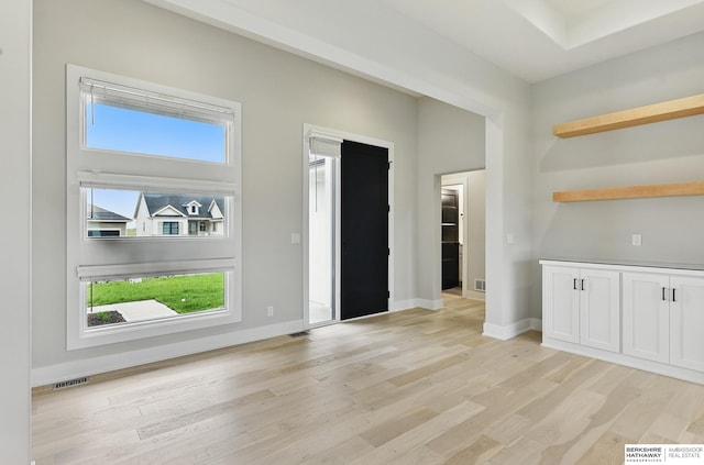 5413 N 212th St, Omaha, NE 68022 - unfurnished dining area featuring plenty of natural light, light wood-type flooring, and baseboards