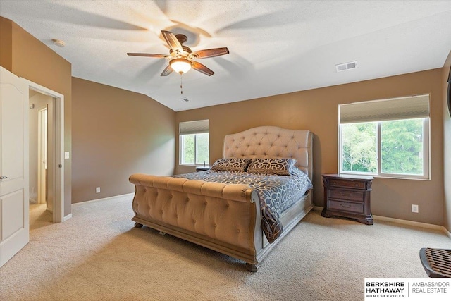 carpeted bedroom featuring baseboards, a ceiling fan, and lofted ceiling
