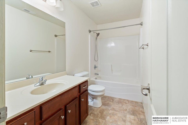 full bathroom featuring toilet, vanity, and washtub / shower combination
