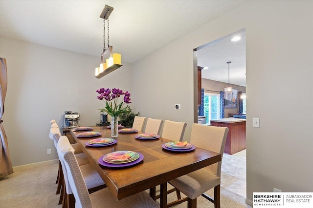 dining room featuring light carpet and recessed lighting