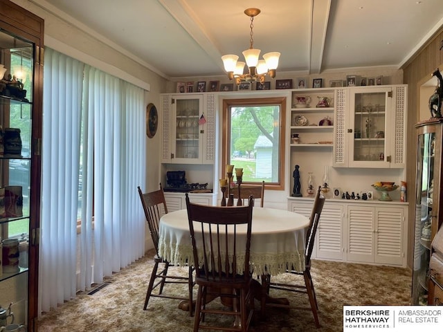 1200 H St, Pawnee City, NE 68420 - dining space with a chandelier, beam ceiling, and crown molding