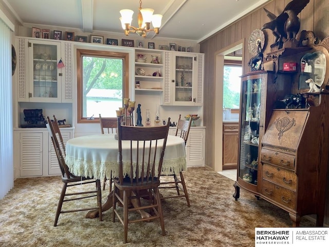 1200 H St, Pawnee City, NE 68420 - dining space with a chandelier, ornamental molding, carpet floors, and beam ceiling