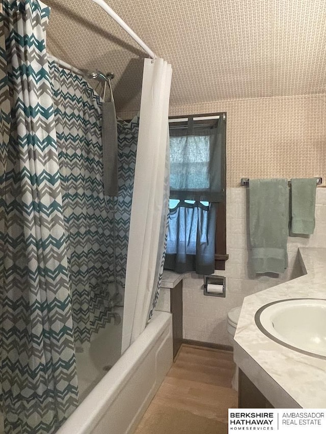 1200 H St, Pawnee City, NE 68420 - bathroom with vanity, shower / tub combo with curtain, and toilet