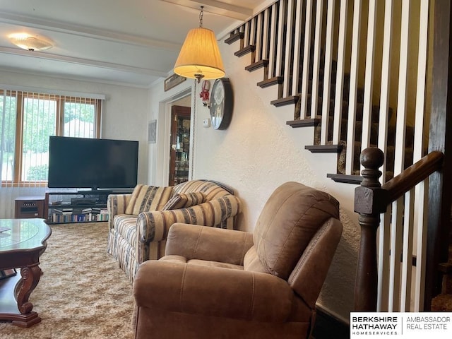 1200 H St, Pawnee City, NE 68420 - carpeted living room with stairs, beamed ceiling, a textured wall, and ornamental molding