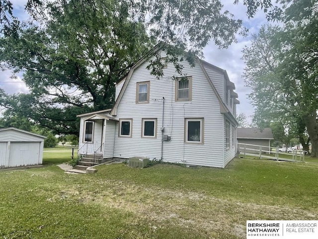 1200 H St, Pawnee City, NE 68420 - back of house featuring a gambrel roof and central AC