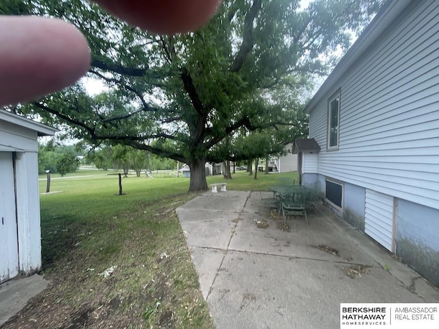 1200 H St, Pawnee City, NE 68420 - view of grassy yard featuring a patio area