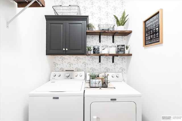 laundry room featuring separate washer and dryer and cabinet space