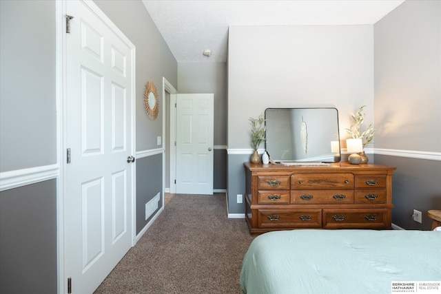 carpeted bedroom featuring baseboards