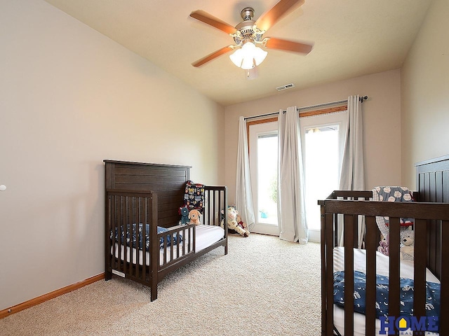 8946 Broken Spoke Dr, Lincoln, NE 68507 - bedroom with light carpet, baseboards, and ceiling fan