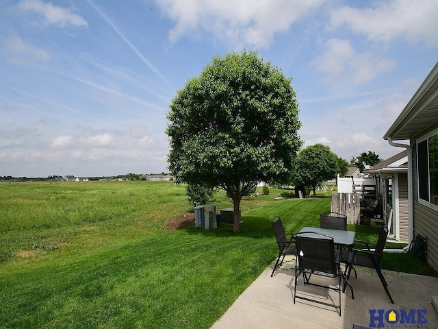 8946 Broken Spoke Dr, Lincoln, NE 68507 - view of grassy yard featuring a patio and outdoor dining area