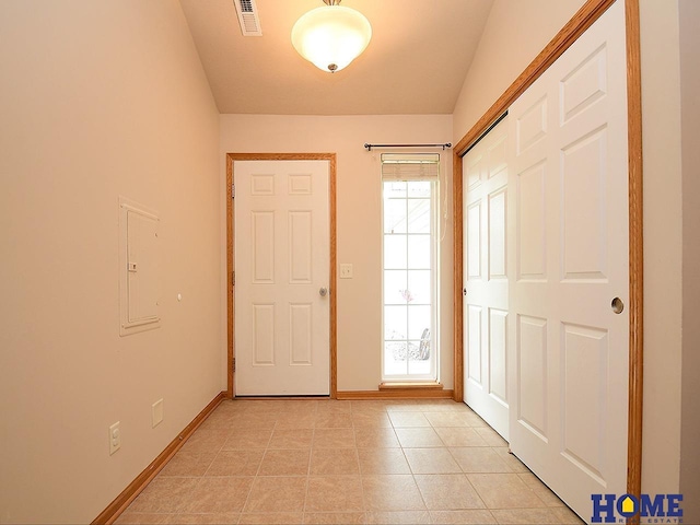 8946 Broken Spoke Dr, Lincoln, NE 68507 - foyer entrance with baseboards, light tile patterned flooring, and electric panel