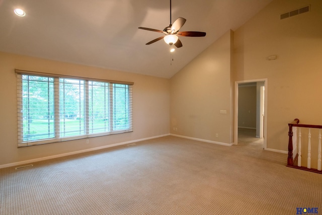 9160 Pioneer Ct, Lincoln, NE 68520 - unfurnished room with light colored carpet, a ceiling fan, baseboards, and high vaulted ceiling
