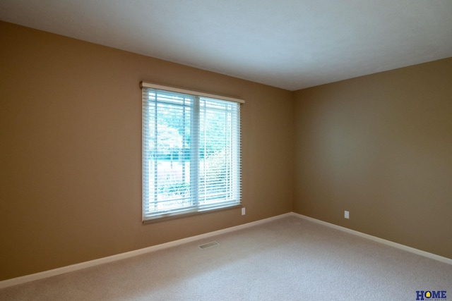 9160 Pioneer Ct, Lincoln, NE 68520 - carpeted spare room featuring baseboards