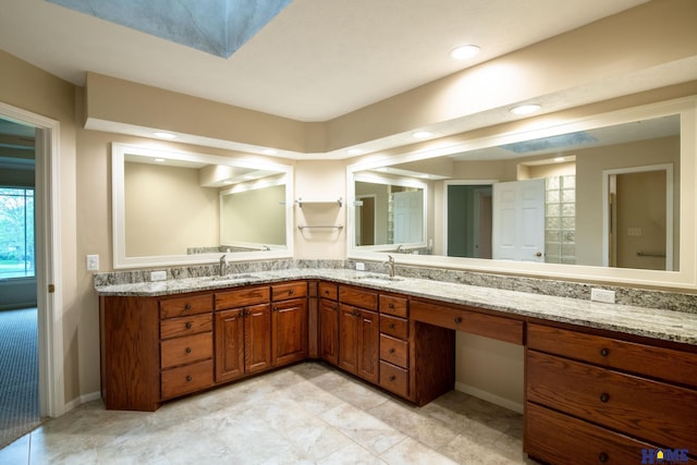 9160 Pioneer Ct, Lincoln, NE 68520 - full bath with double vanity, baseboards, and recessed lighting