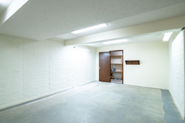 9160 Pioneer Ct, Lincoln, NE 68520 - finished basement featuring brick wall and baseboards