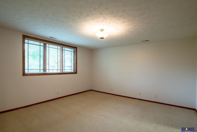 9160 Pioneer Ct, Lincoln, NE 68520 - spare room with light carpet, baseboards, and a textured ceiling