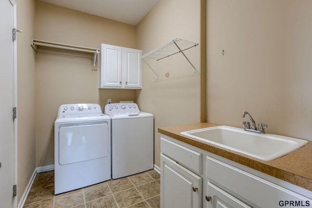 6732 S 169th Ave, Omaha, NE 68135 - laundry area featuring separate washer and dryer, cabinet space, and baseboards