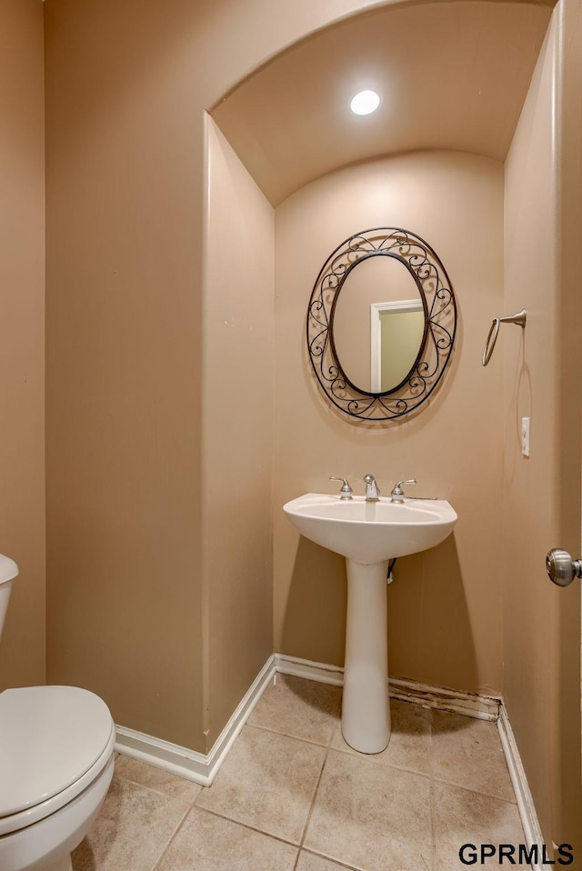 6732 S 169th Ave, Omaha, NE 68135 - bathroom featuring toilet, baseboards, and tile patterned floors