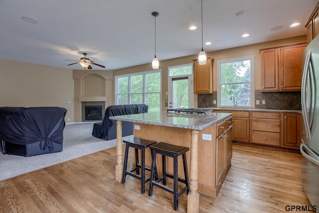 6732 S 169th Ave, Omaha, NE 68135 - kitchen with appliances with stainless steel finishes, plenty of natural light, a kitchen island, ceiling fan, and recessed lighting