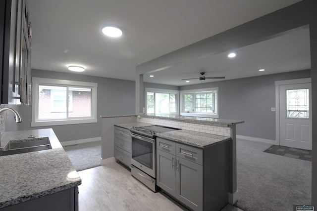 1425 Meadow Dale Dr, Lincoln, NE 68505 - kitchen with electric range, a sink, baseboards, a ceiling fan, and recessed lighting