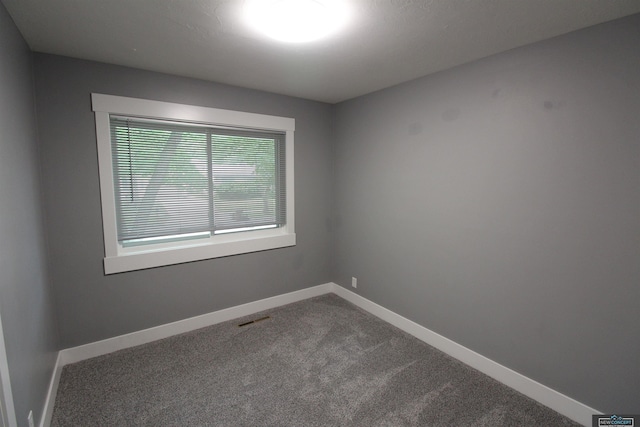 1425 Meadow Dale Dr, Lincoln, NE 68505 - unfurnished room featuring dark colored carpet and baseboards