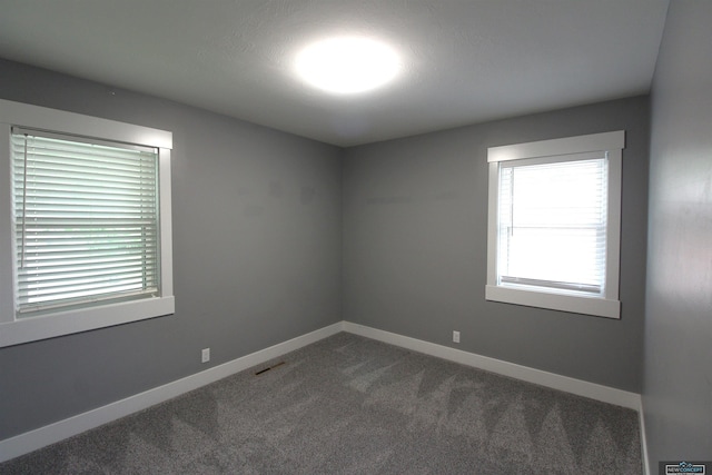 1425 Meadow Dale Dr, Lincoln, NE 68505 - unfurnished room with dark carpet and baseboards