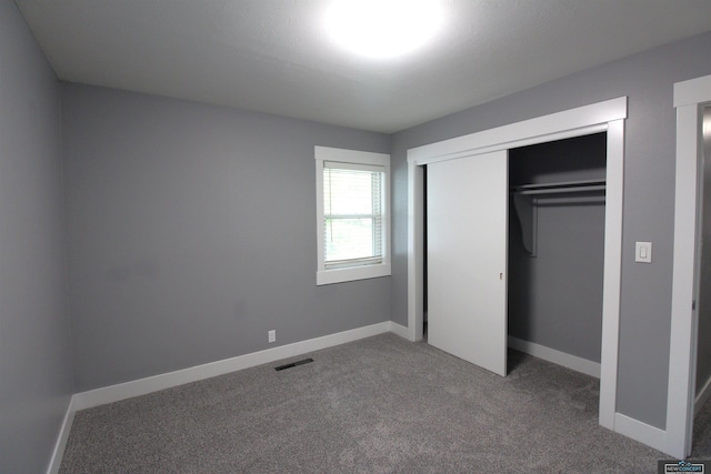 1425 Meadow Dale Dr, Lincoln, NE 68505 - unfurnished bedroom featuring carpet floors, a closet, and baseboards
