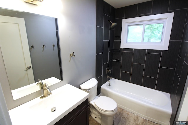 1425 Meadow Dale Dr, Lincoln, NE 68505 - bathroom with toilet, tub / shower combination, vanity, and wood finished floors