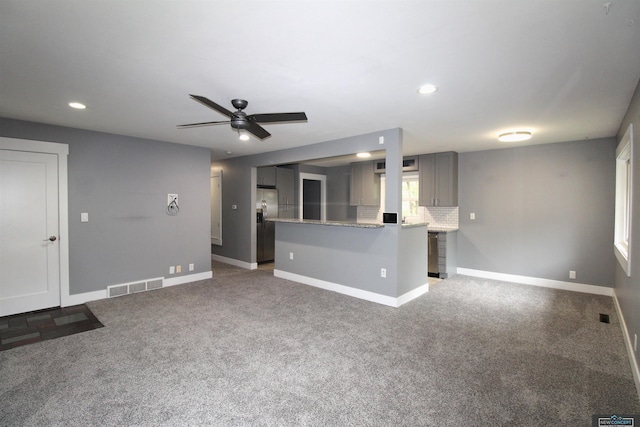 1425 Meadow Dale Dr, Lincoln, NE 68505 - unfurnished living room featuring baseboards, recessed lighting, carpet floors, and a ceiling fan