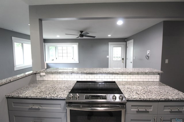 1425 Meadow Dale Dr, Lincoln, NE 68505 - kitchen featuring electric stove, gray cabinets, recessed lighting, a ceiling fan, and light stone countertops