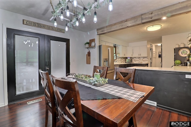 1131 Elizabeth Cir, Fremont, NE 68025 - dining room featuring hardwood / wood-style floors and beam ceiling
