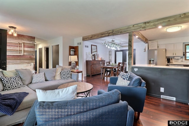 1131 Elizabeth Cir, Fremont, NE 68025 - living area with beamed ceiling and dark wood-type flooring