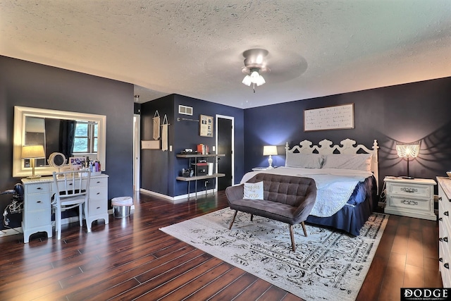 1131 Elizabeth Cir, Fremont, NE 68025 - bedroom featuring a textured ceiling, wood finished floors, and baseboards