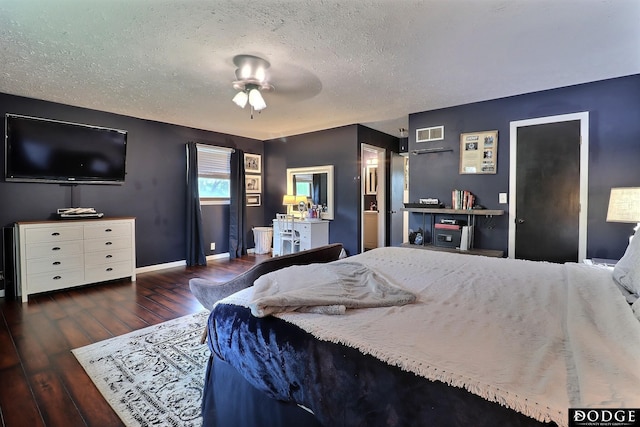 1131 Elizabeth Cir, Fremont, NE 68025 - bedroom featuring wood finished floors, a textured ceiling, baseboards, and a ceiling fan